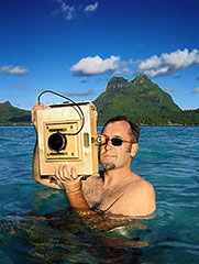 Brian Smith 1977 Ames High School Alum in the water shooting with an 8x10 camera at Bora Bora